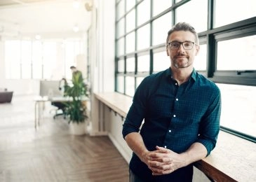 Portrait of a confident mature businessman working in a modern office.