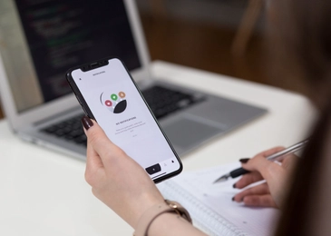 A woman with a smartphone in an hand