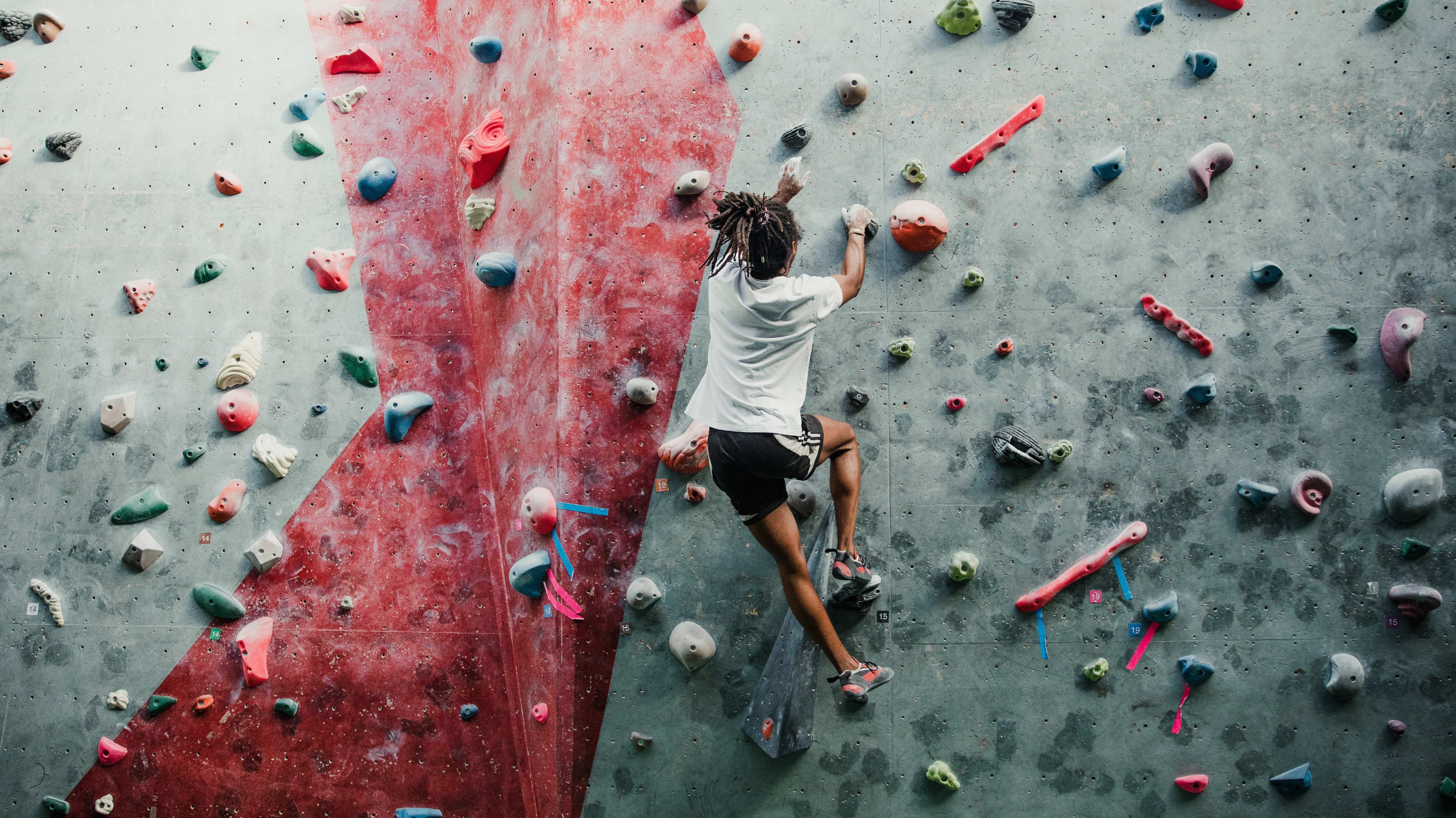 Young man enjoying rock climbing