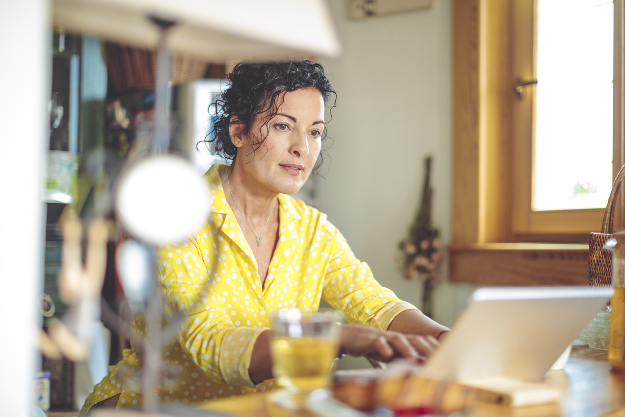 mature-woman-is-checking-her-finances-at-home